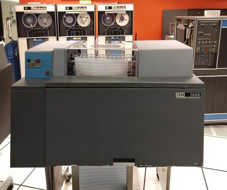 The IBM 1403 printer in front of the popular 1401 business computer (right) and 729 tape drives (left).