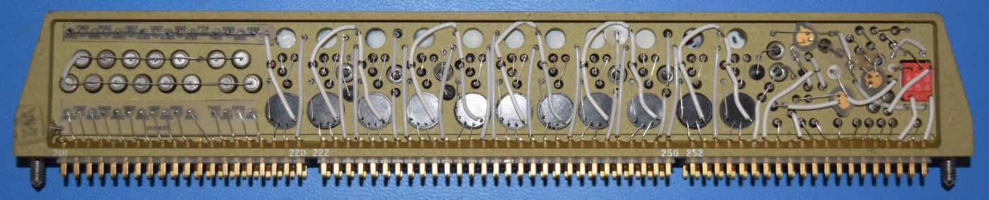 Most of the cordwood modules, such as this interface module, had components running from side-to-side through the module.
