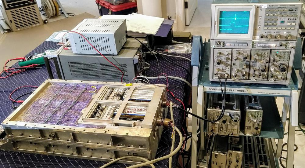 Debugging the simulator boxes. We're used Marc's vintage Tektronix 7854 scope (1980) to examine the pulse transformer's differential signals. The problem turned out to be a broken connection in the cordwood circuitry. Behind the AGC are the power supplies for the AGC and the rope simulator.