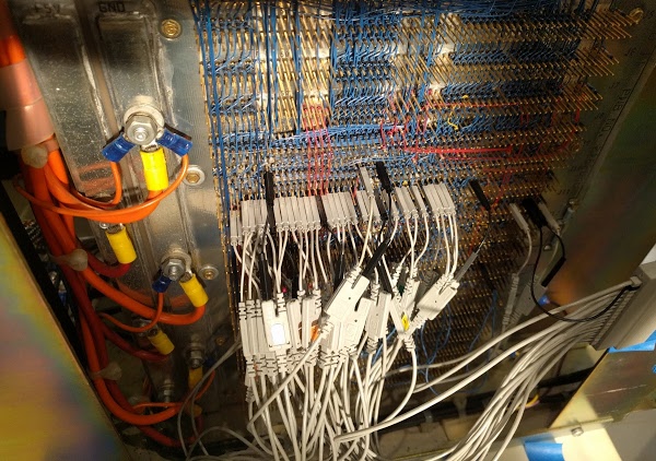 The backplane of the Xerox Alto, with probes from the logic analyzer attached to trace microcode execution. Note the thick power wires on the left.