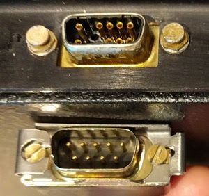 The Alto's mouse plugs into the 19-pin connector on the keyboard housing (above). Unfortunately our mouse has a 9-pin connector (below).