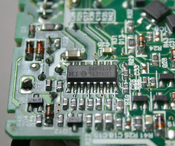 The circuit board inside the Macbook charger. The chip in the middle controls the switching power supply circuit.