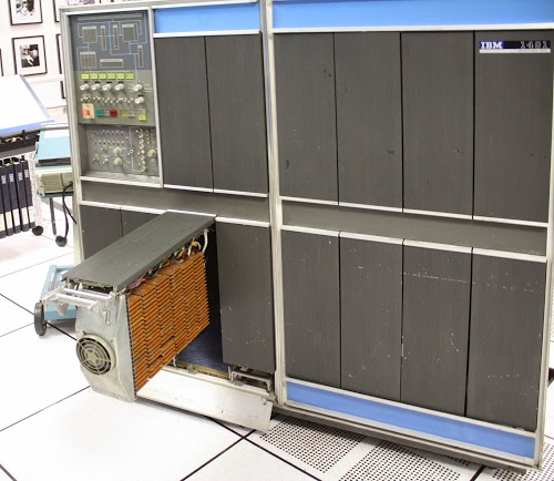 The IBM 1401 computer with gate 01B3 open, showing the timing and logic circuitry.
