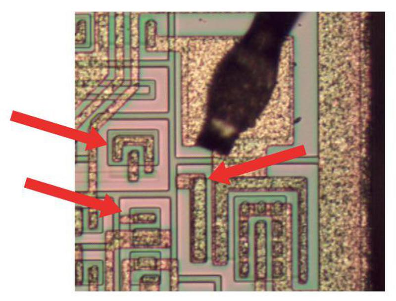 The output driver circuitry has some unused transistors, marked with arrows.