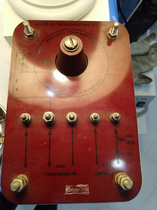 Front view of the igniter. The black text is hard to read under the brown front.