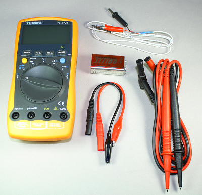 What comes in the box with the Tenma 72-7740 DMM: temperature probe, battery, alligator clips, and probes.