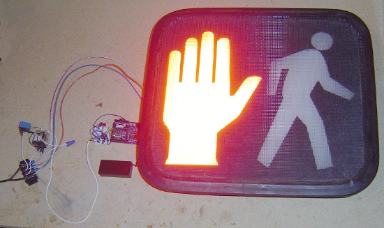 A pedestrian sign controlled by an Arduino.