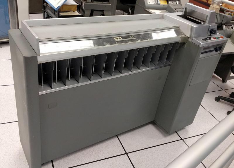 An IBM Type 83 card sorter. Cards enter the machine on the right, whiz along the top of the machine, and fall into the appropriate hopper underneath.