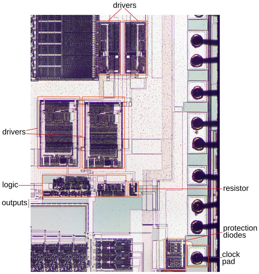Details of the clock circuitry. This image shows the two metal layers. At the right, bond wires are connected to the pads on the die.
