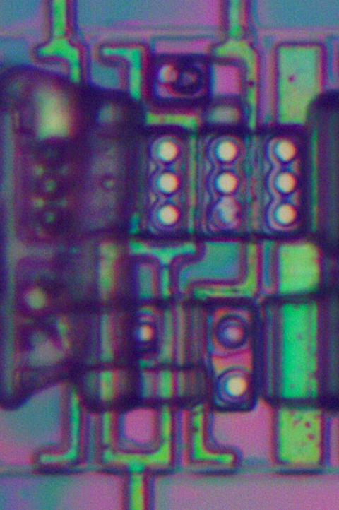 A large NAND gate as it appears on the die, with the metal removed. The left side is slightly obscured by some remaining oxide.