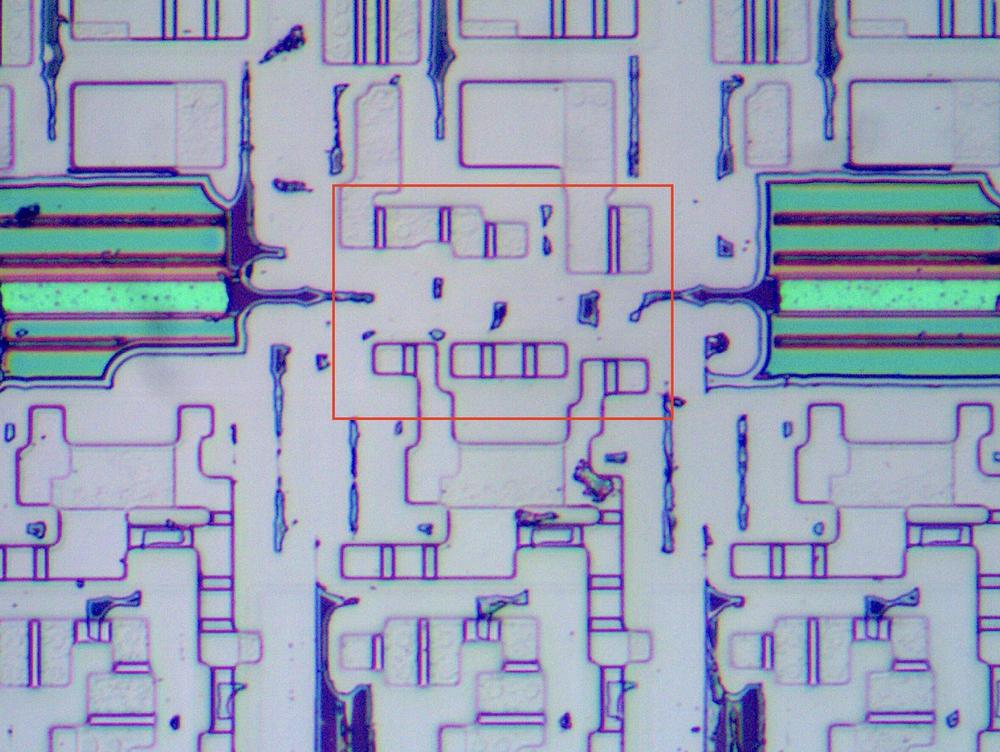 The pass-transistor XOR circuit on the die. The green regions are oxide that was not completely removed causing thin-film interference.