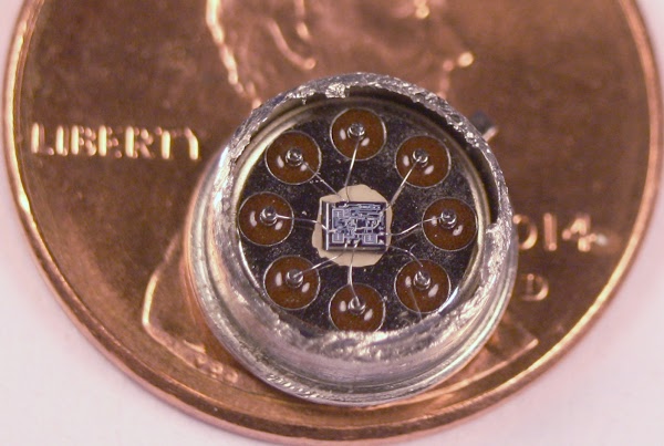 Inside the 555 timer. The tiny die in the package is connected to the 8 pins by wires.