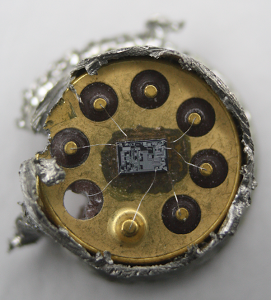 Inside a 741 op amp, showing the die. This is a TO-99 metal can package, with the top sawed off