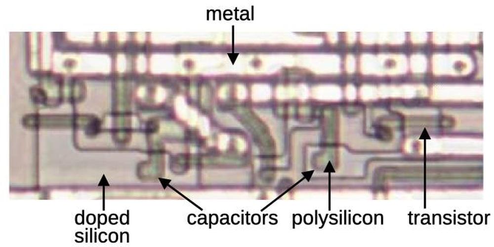 Two capacitors in the 8087. This photo shows the metal layer with the silicon and polysilicon underneath. Two capacitors in the 8087. This photo shows the metal layer with the silicon and polysilicon underneath.