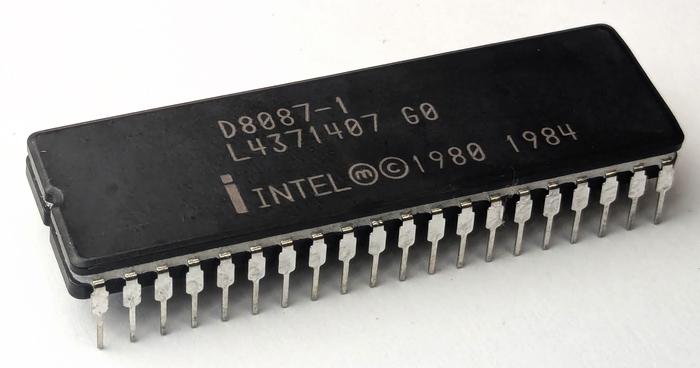 The Intel 8087 chip is packaged in a 40-pin DIP (dual in-line package), as are the 8080 and Z80. This photo is here as a break from all the microcode. The Intel 8087 chip is packaged in a 40-pin DIP (dual in-line package), as are the 8080 and Z80. This photo is here as a break from all the microcode.