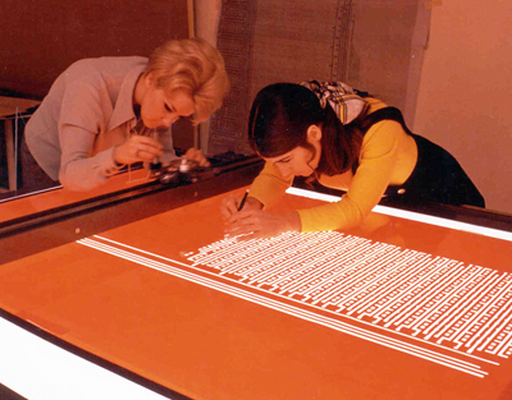 Intel photo of two women cutting Rubylith.