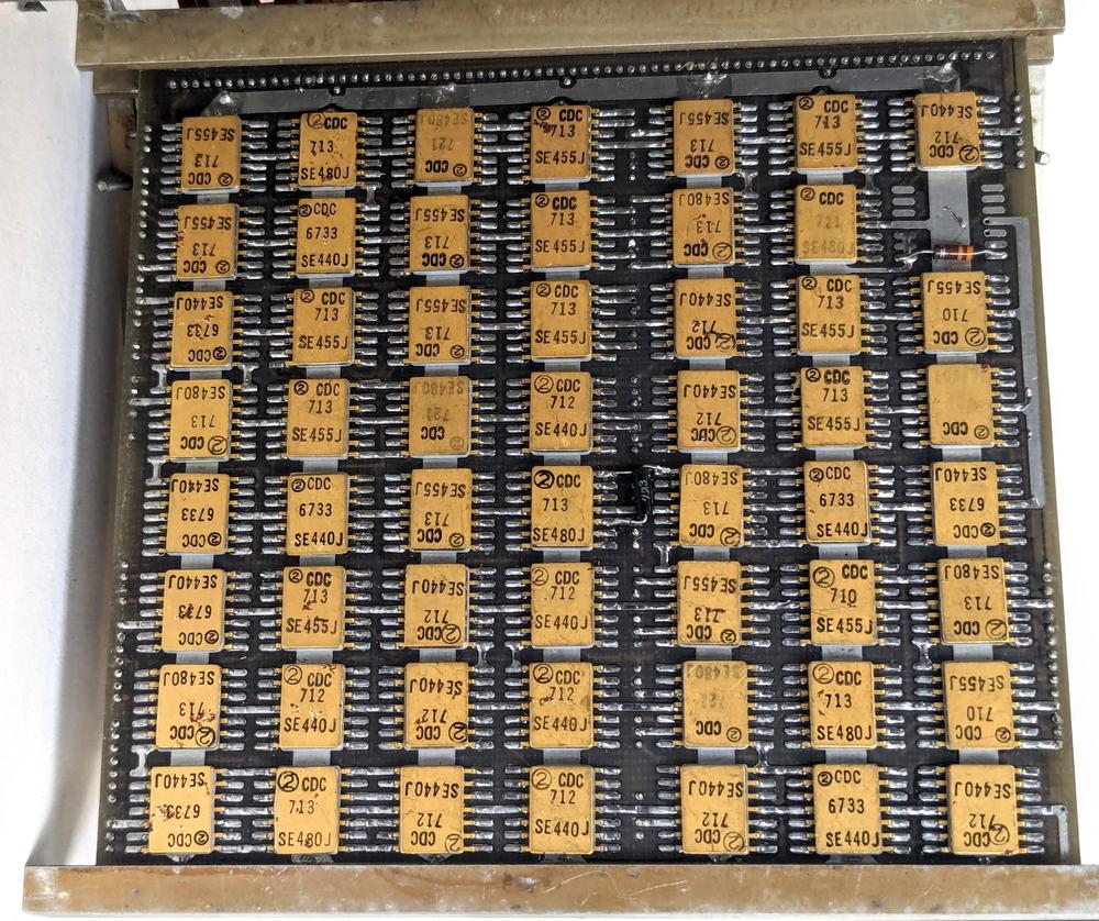 A board filled with flat-pack logic ICs.