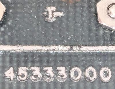 Closeup of a circuit board showing a number, maybe identifying the board.
