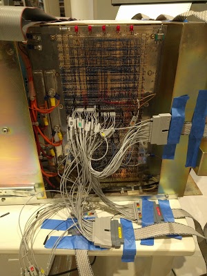 Backplane of the Xerox Alto wired with logic analyzer probes. These probes monitor the executing micro-instructions and the contents of the ALU bus.