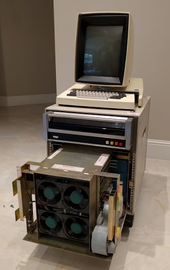 The Xerox Alto II XM 'personal computer'. The card cage below the disk drive has been partially removed. Four cooling fans are visible at the front of it.