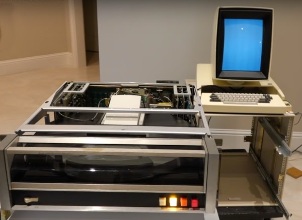The Xerox Alto's drive powered up, along with monitor (showing a white screen).