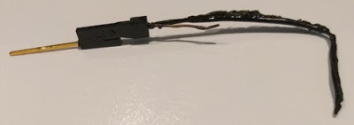 This logic probe wire melted when we accidentally connected +5 volts and ground with it.