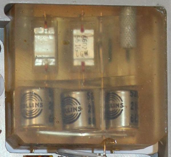 The encapsulated block appears to contain three transistors and five capacitors.