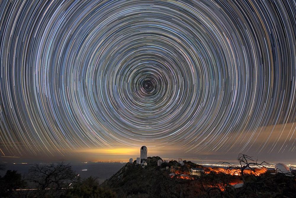 Kitt Peak National Observatory beneath star trail. Credit: DESI Collaboration/DOE/KPNO/NOIRLab/NSF/AURA/L. Tyas, CC BY 4.0.