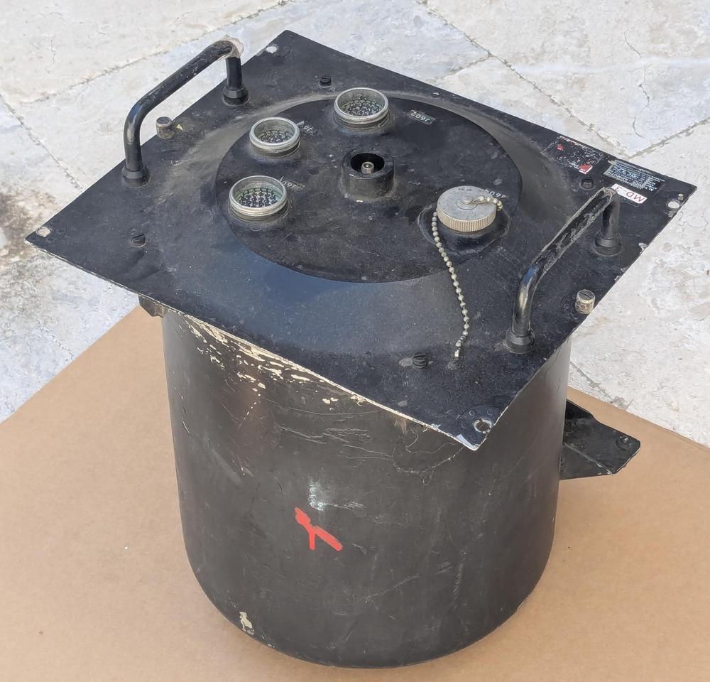 The Angle Computer is packaged in a nondescript black cylinder.