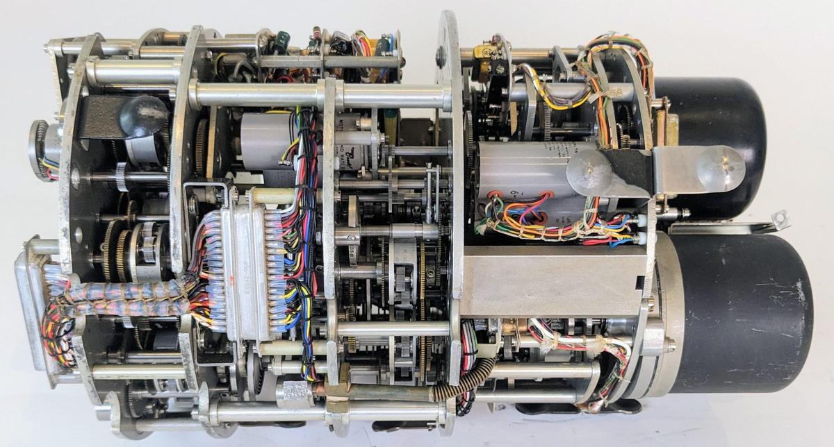 The Bendix MG-1A Central Air Data Computer with the case removed, showing the compact gear mechanisms inside. Click this image (or any other) for a larger version.