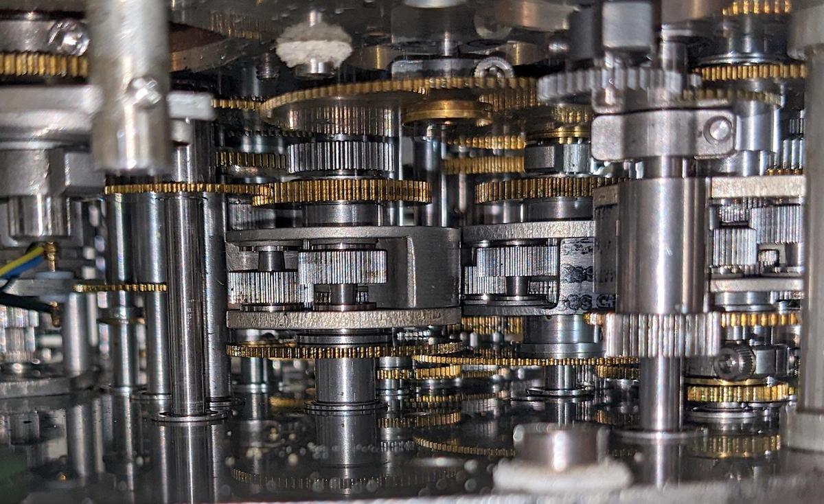 A closeup of the numerous gears inside the CADC. Three differential gear mechanisms are visible.
