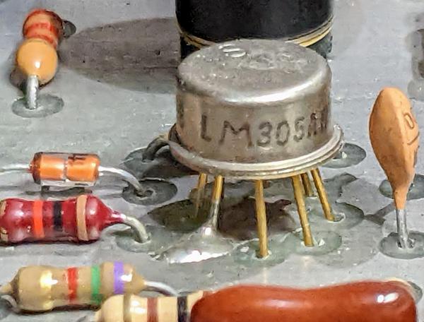 The LM305A integrated circuit is in an old-fashioned metal can.