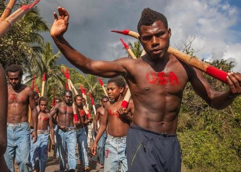 Members of the John Frum cargo cult, marching with bamboo "rifles". Photo adapted from The Open Encyclopedia of Anthropology, (CC BY-NC 4.0).