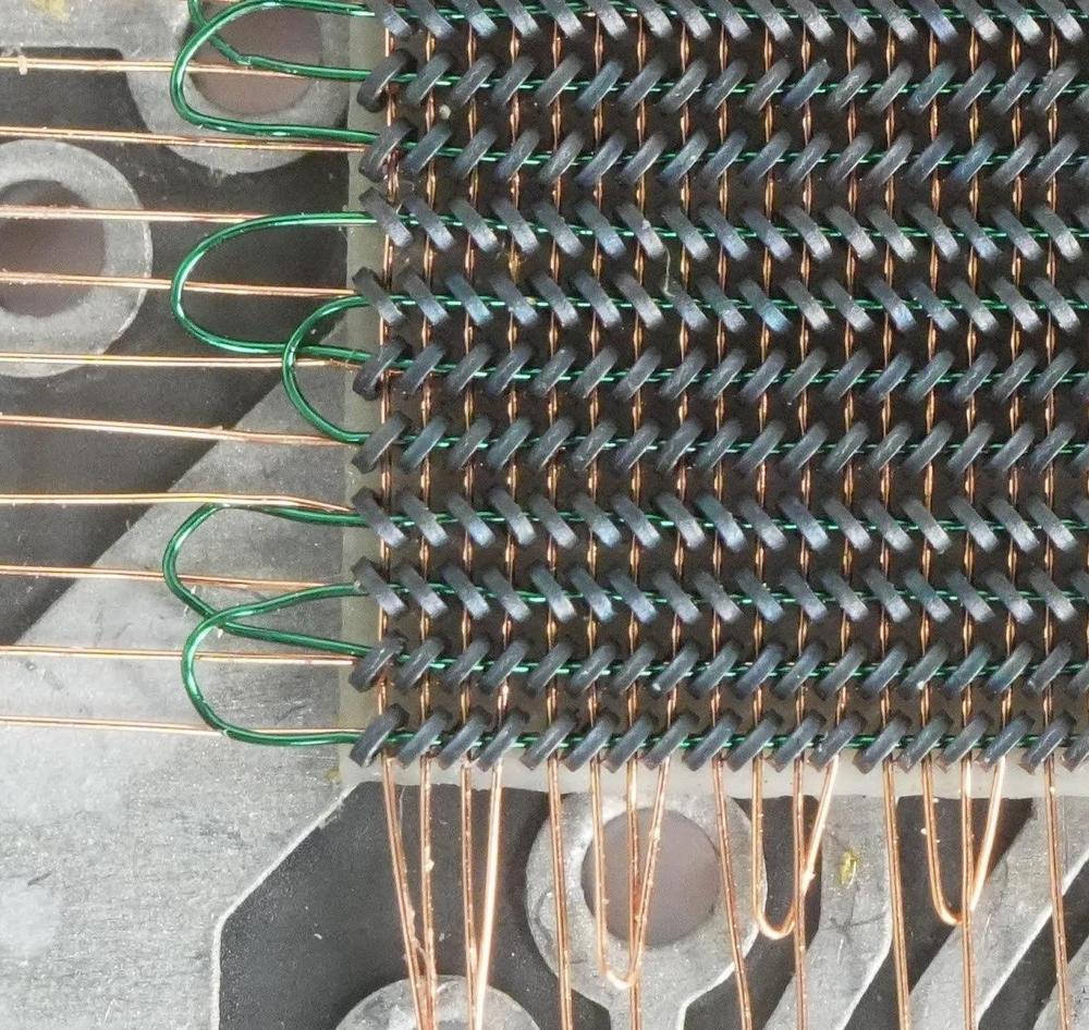 A close-up of the cores. I think that some rows tilt left and some tilt right to ensure that the sense lines keep the same polarity when they switch direction. Photo courtesy of CuriousMarc.