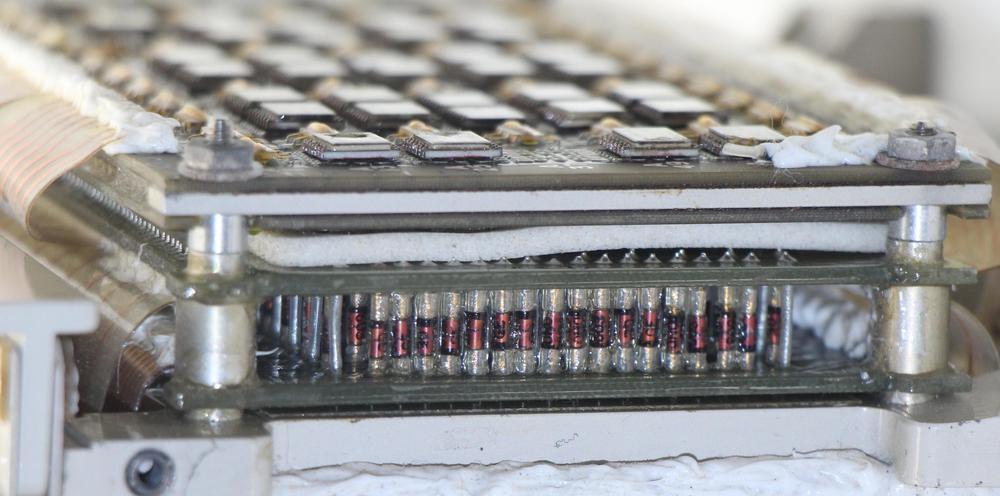 Closeup of the diode matrix in the Saturn V LVDC. Diodes are mounted vertically using cordwood construction between two printed circuit boards.