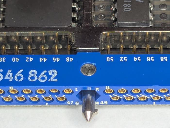 A close-up of the connector, showing the keying. Also note that the zig-zag pin numbering on the left changes to an irregular number on the right. Unexpectedly, pin 52 is between pins 49 and 51, for example,
