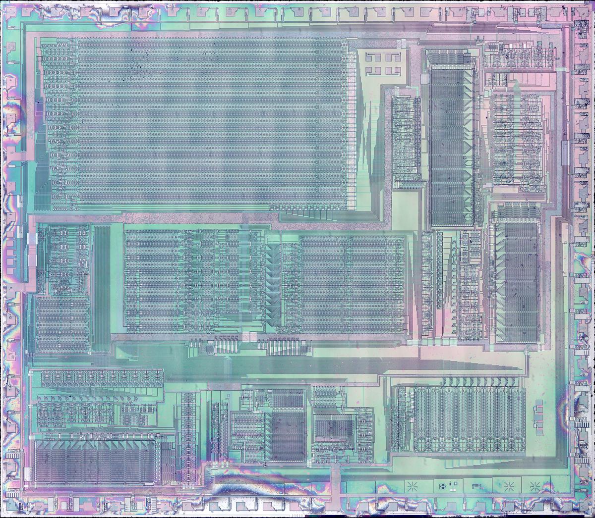 Die photo of the DX7's YM21280 Operator chip with the metal layer removed.  Click this photo (or any other) for a magnified version.