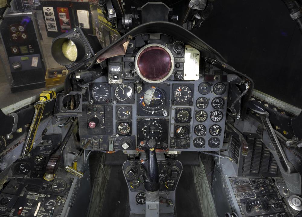 The cockpit of the F-4C Phantom II, with the attitude indicator in the center of the panel. Click this photo (or any other) for a larger version. Photo from National Museum of the USAF.