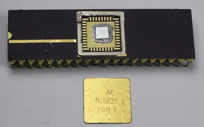The MC6820 chip with the metal lid popped off to reveal the silicon die.