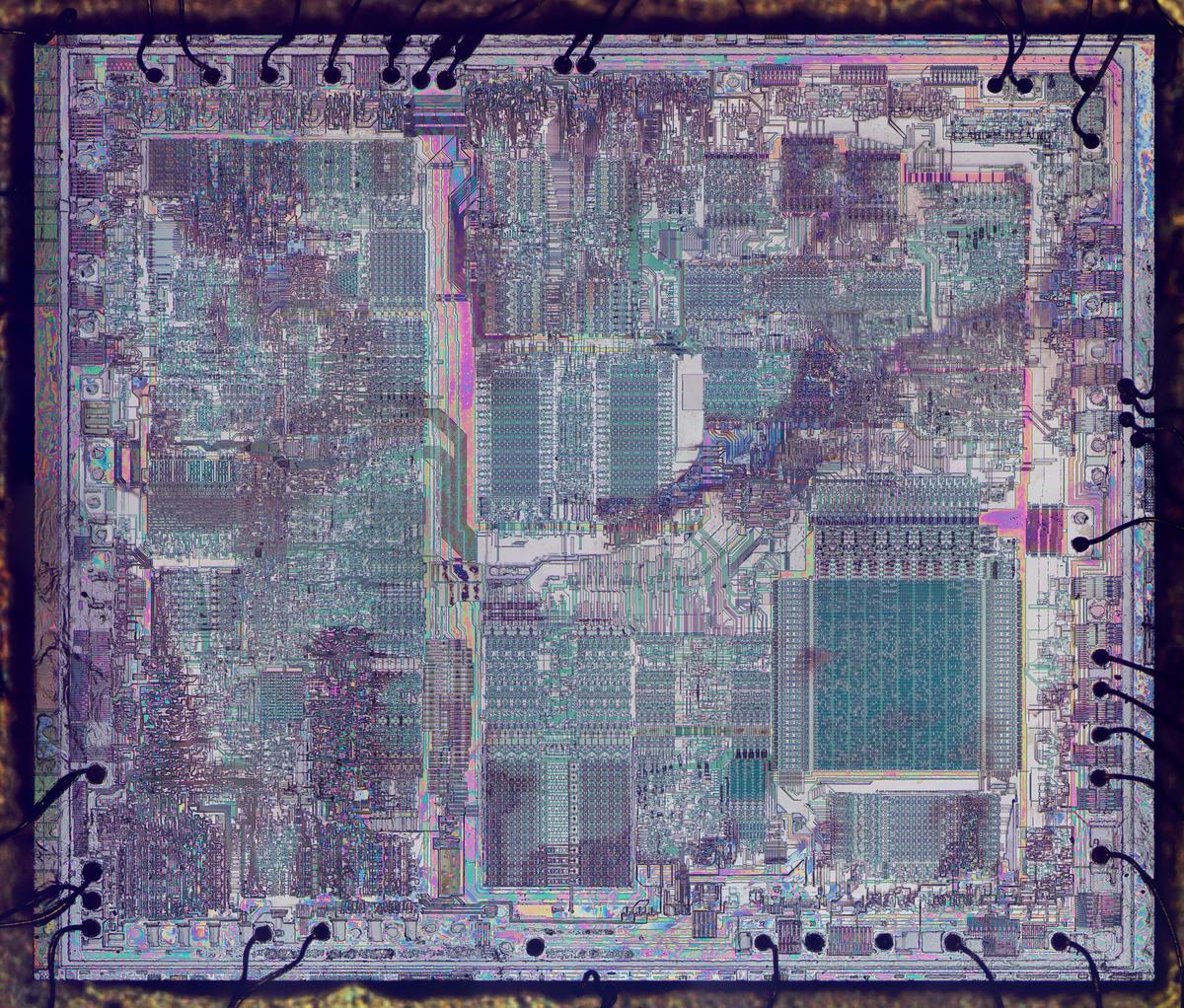 A high-resolution image of the die with the metal removed. (Click for a larger version.) Some of the oxide layer remains, causing colored regions due to thin-film interference.
