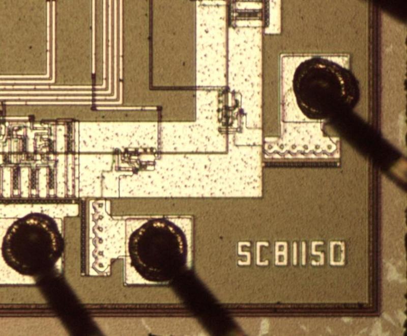 The corner of the die is marked with the SC81150 part number. Bond pads and bond wires are also visible.