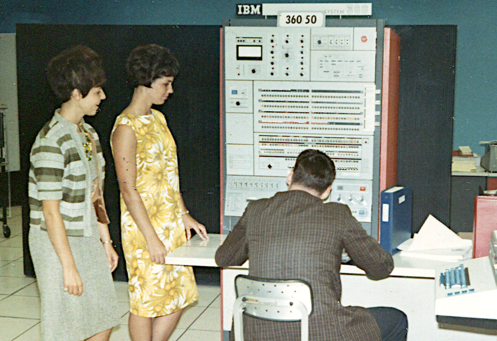 IBM S/360 Model 50. The console was attached to the main frame, about 5 feet deep. The storage frame and power frame are the black cabinets at the back. Photo from Pinterest.