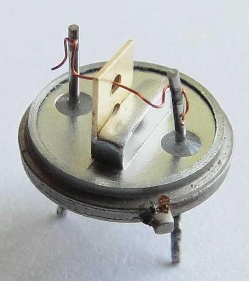 Inside a germanium alloy-junction transistor used in the IBM 1401 computer. This is an IBM type 083
NPN transistor. Photo from
  IBM 1401 restoration team
