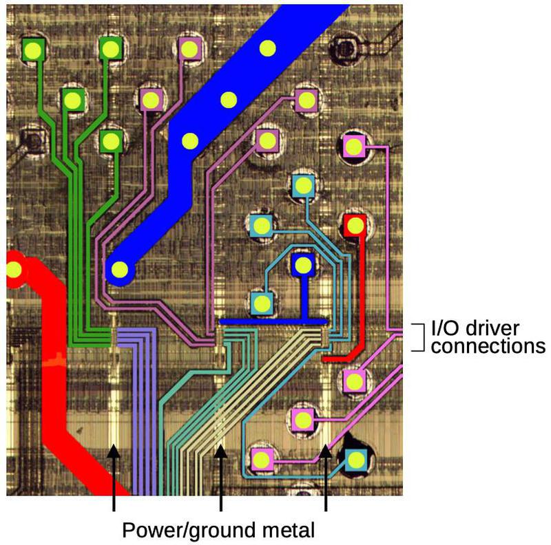 The colored lines show how the top layer of metal wiring connects the solder balls to the chip.