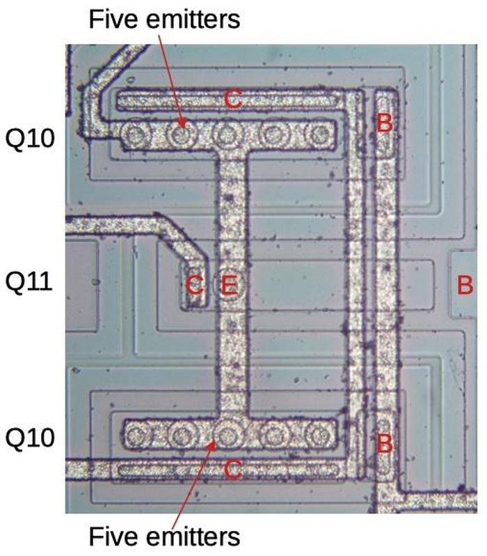 Transistors Q10 and Q11 are the key to the bandgap reference. Q10 has 10 emitters, so each has 1/10 the current as Q11.