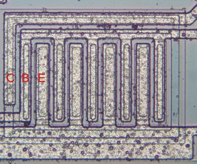 A large, high-current NPN output transistor in the LM185 chip. The collector (C), base (B) and emitter (E) are labeled.