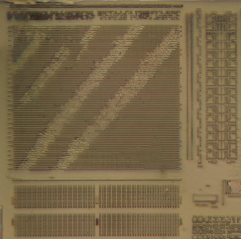 A closeup of the presumed EEPROM circuitry on the die.