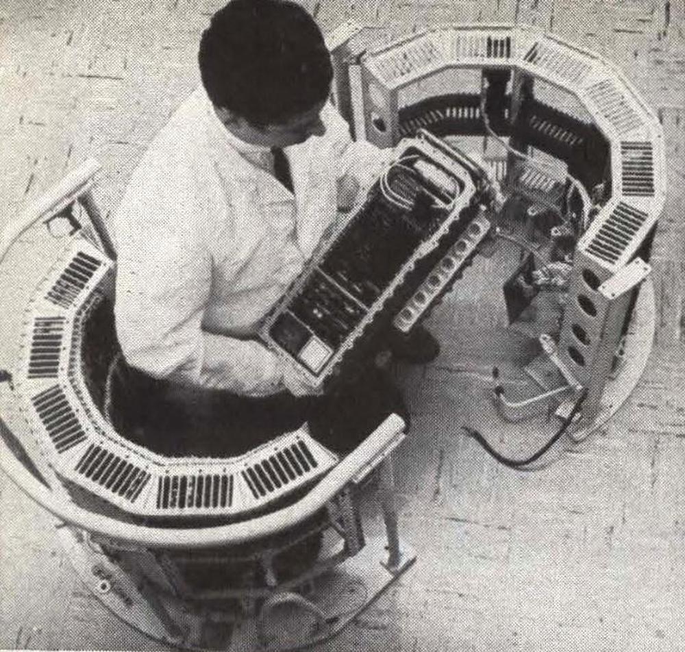 The Minuteman D-17B computer (cylinder) and D-37B computer (being held). From Microcomputer comes off the line, Electronics, Nov 1, 1963. Using modern definitions, the computer was a minicomputer, not a microcomputer.