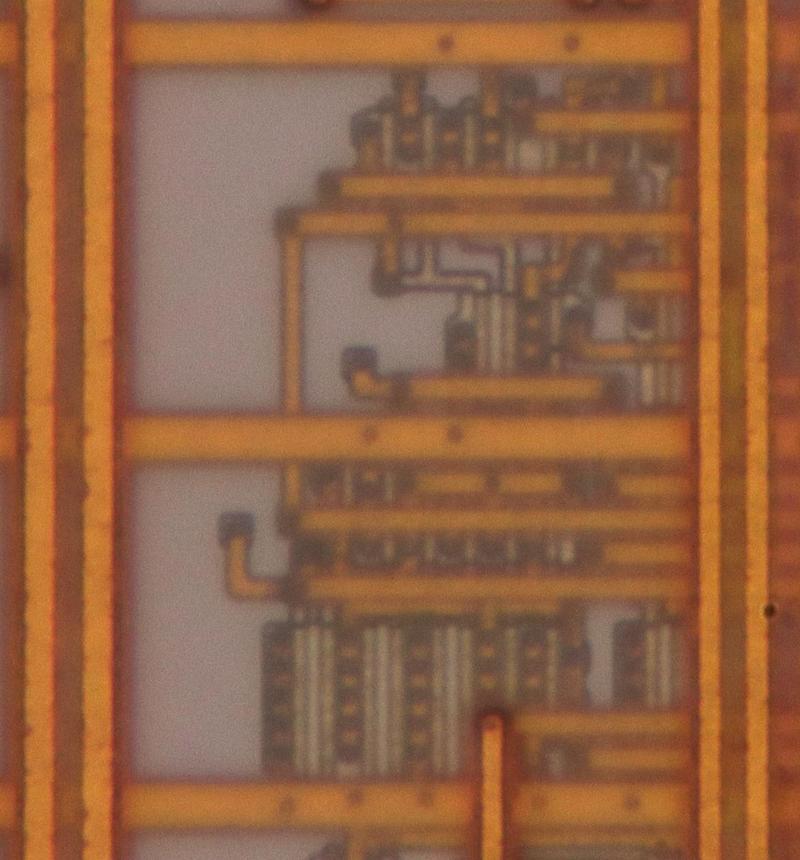 Closeup of the Pentium die showing the metal layers.
The L-shaped hook towards the lower left is a connection to an antenna diode.
This photo shows a tiny part of the floating point unit. To show all the layers in focus, I combined multiple images with focus stacking.