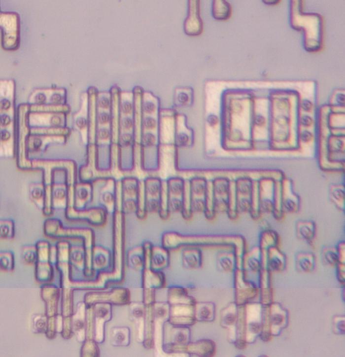 The polysilicon and silicon layers form the Pentium's transistors. This photo shows part of the complete circuit.